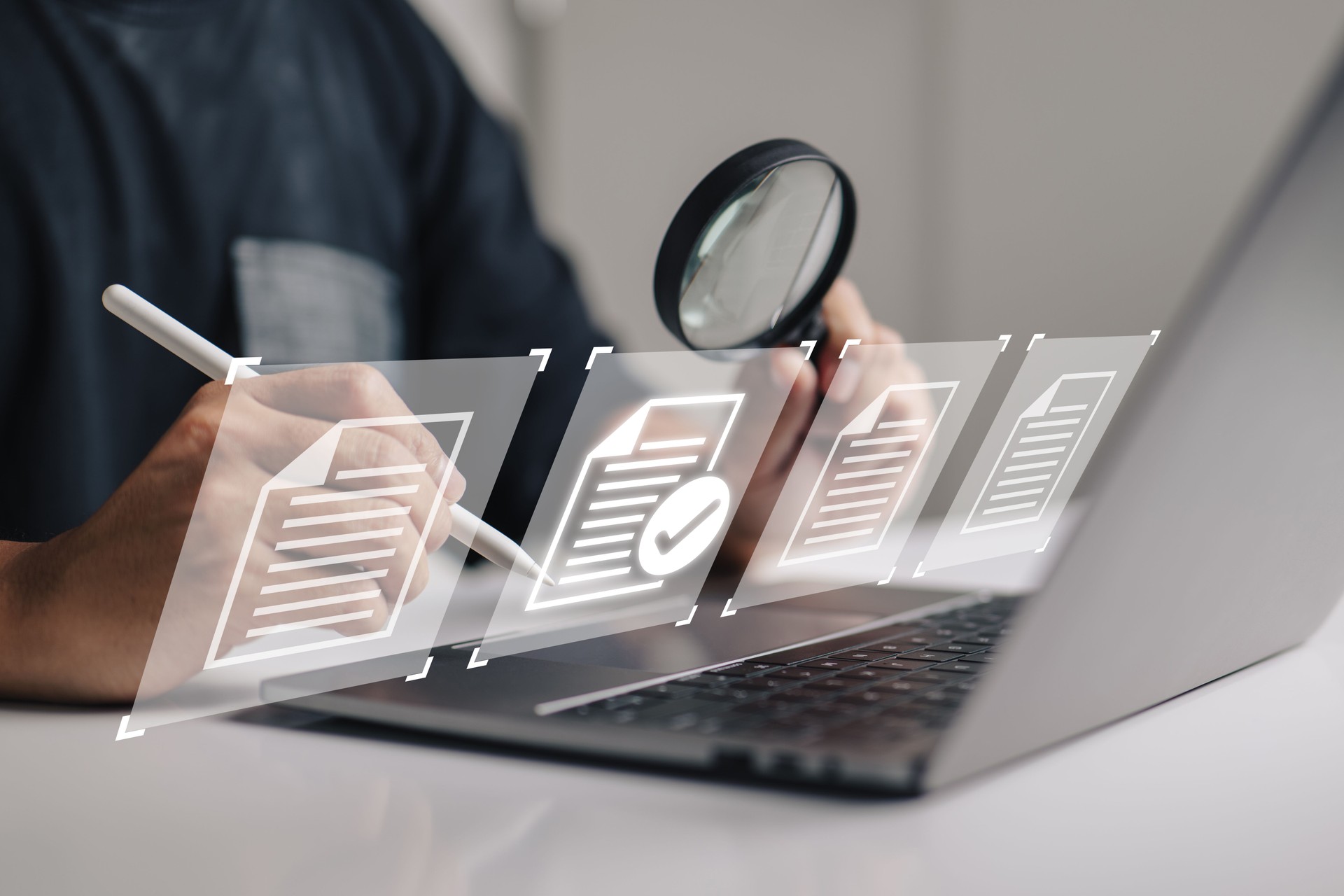 hand using a laptop computer with a virtual screen and document for paperless quality assurance and ERP management concept for online approval.